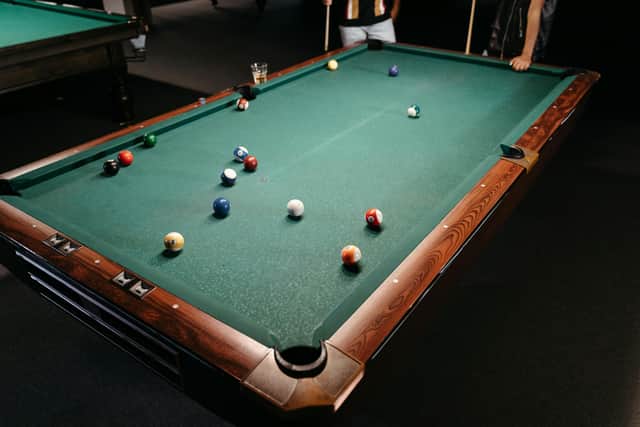 Woolwich Snooker Club has avoided having its licence revoked after its manager attacked a customer outside the premises