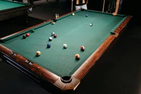 Woolwich Snooker Club has avoided having its licence revoked after its manager attacked a customer outside the premises