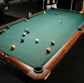 Woolwich Snooker Club has avoided having its licence revoked after its manager attacked a customer outside the premises
