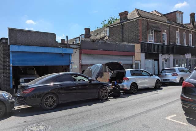 Residents say 'associates' gather outside the garage throughout the day and into the evening