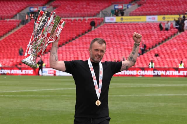 Nathan Jones, Head Coach of Charlton Athletic, celebrates with the League One Play-off Final Trophy after his team's victory in the Sky Bet League One Play Off Final match between Charlton Athletic and Leyton Orient at Wembley Stadium on May 25, 2025 in London, England.