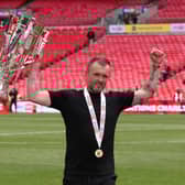 Nathan Jones, Head Coach of Charlton Athletic, celebrates with the League One Play-off Final Trophy after his team's victory in the Sky Bet League One Play Off Final match between Charlton Athletic and Leyton Orient at Wembley Stadium on May 25, 2025 in London, England. 