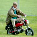 HRH The Duke of Edinburgh rides on his mini motorbike during the Royal Windsor Horse Show at Home Park, Windsor Castle on May 13, 2005