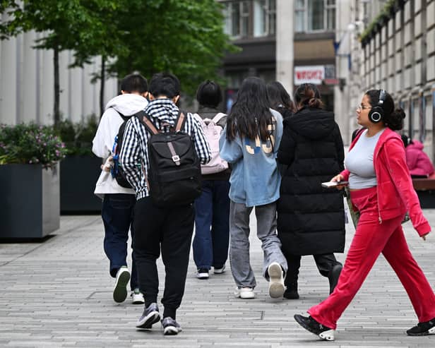 Students make their way around the London School of Economics campus, in central London
