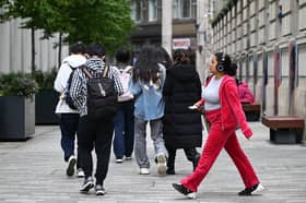 Students make their way around the London School of Economics campus, in central London