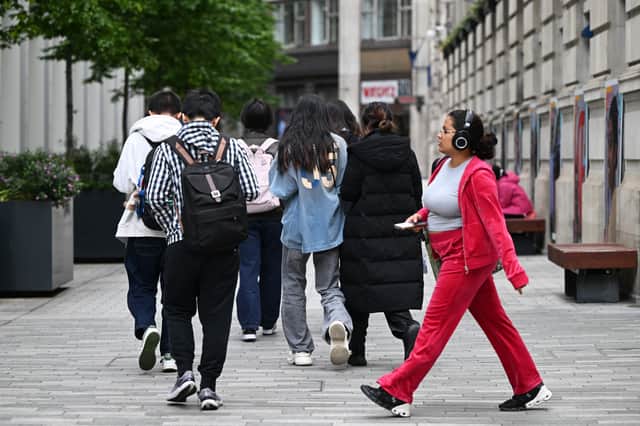 Students make their way around the London School of Economics campus, in central London