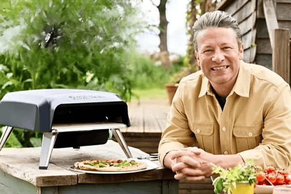 Jamie Oliver with his Tefal gas pizza oven, designed for quick, even-cooked homemade pizzas in the garden