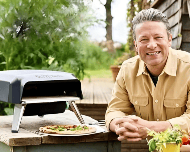 Jamie Oliver with his Tefal gas pizza oven, designed for quick, even-cooked homemade pizzas in the garden