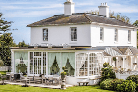 Merston House blends timeless Regency architecture with modern country living, complete with an orangery and sun-soaked patio for entertaining.