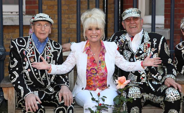 Barbara Windsor poses alongside the Pearly Kings in 2012