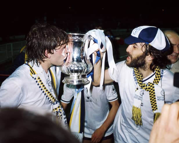 Tottenham Hotspur players Glenn Hoddle (l) and Ricky Villa celebrate with the FACup