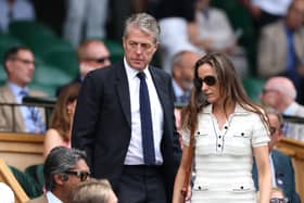Hugh Grant and Anna Elisabet Eberstein arrive in the Royal Box at Wimbledon 
