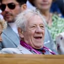 Sir Ian McKellen smiles from the Royal Box at Wimbledon