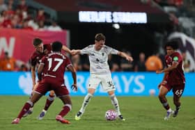Freddie Potts and West Ham teammates in action against Manchester United.