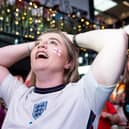 England fans celebrate England beating Spain in the Women's Euro final as they watch a live broadcast of the football match , at Boxpark Wembley
