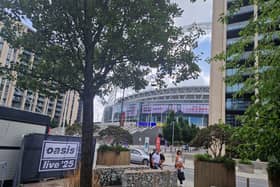 A man has died after falling from the upper tier during an Oasis gig at Wembley Stadium.