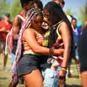 People gather in Queen Elizabeth Olympic Park to celebrate the 20th anniversary of UK Black Pride