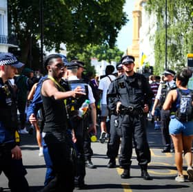 Police stand by the entrance of the Notting Hill Carnival on August 25, 2025 in London