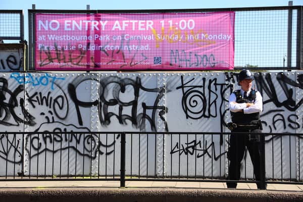 A police officer watches on during the Notting Hill Carnival on August 25, 2025 in London