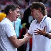 Crystal Palace's Austrian manager Oliver Glasner (L) talks with Brentford's Danish head coach Thomas Frank (R) ahead of kick-off in the English Premier League football match between Brentford and Crystal Palace at the Gtech Community Stadium in London on August 18, 2024. 