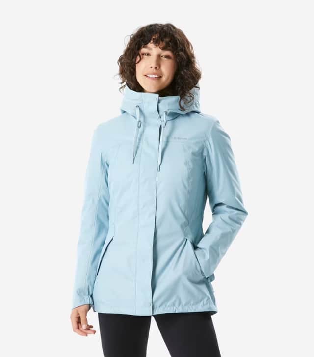 Quechua Women’s waterproof hiking jacket in rainy blue colour.