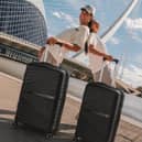 The black ATX Luggage 21-inch cabin suitcase has a 44-litre capacity, four double spinner wheels and a built-in TSA-approved lock.