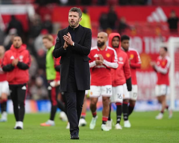 Michael Carrick applauds the fans after his side’s 3-0 home defeat to Bournemouth 