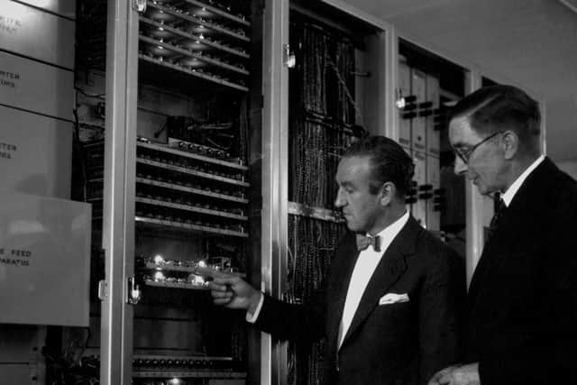 In 1957, Ernest Marples (left), the then Postmaster General, inspects 'Ernie' (Electronic Random Number Indicating Equipment) at the Premium Savings Bonds office in Lytham St Annes