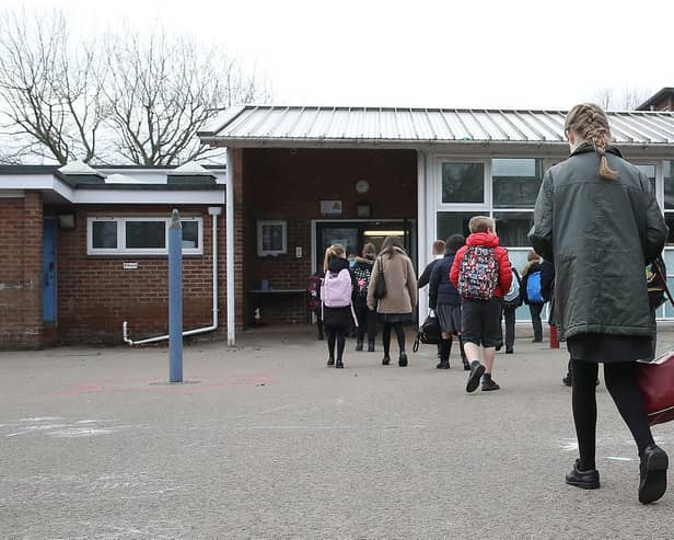 Children arrive at Manor Park School and Nursery in Knutsford, Cheshire, as pupils in England return to school for the first time in two months as part of the first stage of lockdown easing. Picture date: Monday March 8, 2021.
