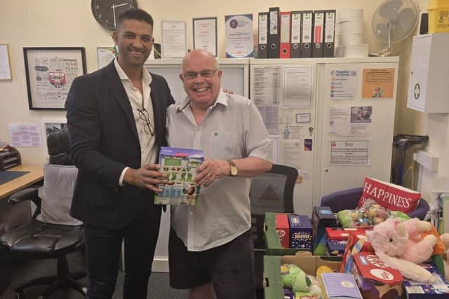 • Alastair Glossop, Button House Senior Retirement Advisor, hands donations over to Ian Turner, Trustee of Sutton Night Watch