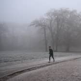 Person runs in frosty weather.