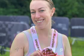 Annabel Fisher with her medal after completing the Solihull half marathon.