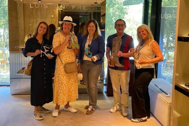Luís Onofre luxury footwear admired by Chris, flanked by Associação Avenida da Liberdade executive director Inês Ortigão Malato (left) and (right) Portuguese Association of Tourist Guides and Tour Managers' Cláudia Machado