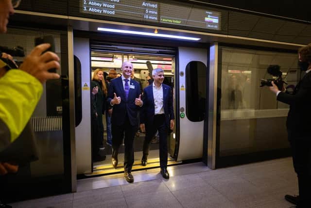 LONDON, ENGLAND - MAY 24: Mayor of London Sadiq Khan (R) and TfL Commissioner Andy Byford disembark after travelling on the first eastbound train on the Elizabeth Line as it opens to the public at Paddington Station on May 24, 2022 in London, England. Originally due to open in December 2018, the £18.8bn railway links Reading and Essex via central London. (Photo by Leon Neal/Getty Images)