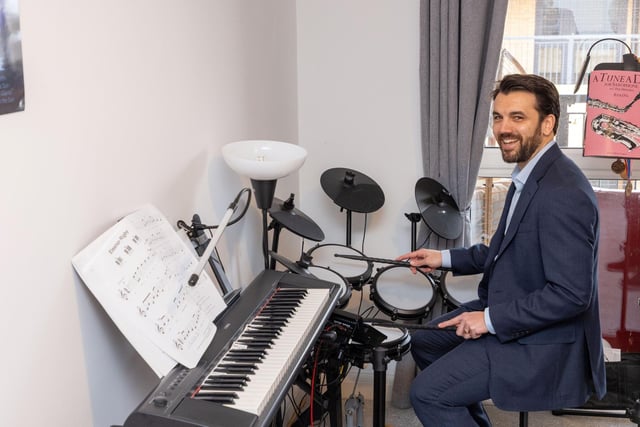 MP Bobby Dean testing out resident Ian Jones’ drum kit. Ian kindly showed the MP around his apartment at Button House.