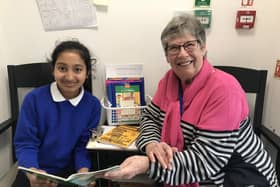 Schoolreaders Volunteer Supporting a Child With Their Reading