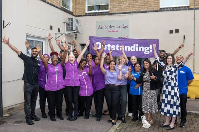 The team celebrate their success.