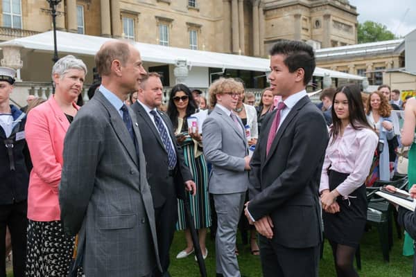 Louis Liu with HRH The Duke of Edinburgh and Ruth Marvel.