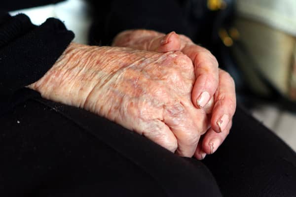 File photo dated 07/10/13 of the hands of an elderly woman at home. Councils are struggling to meet rising requests for adult social care support and some people are cutting back on their home care amid the cost-of-living crisis while "completely overwhelmed" family carers try to fill the gaps, the health watchdog has said. Issue date: Friday October 20, 2023.