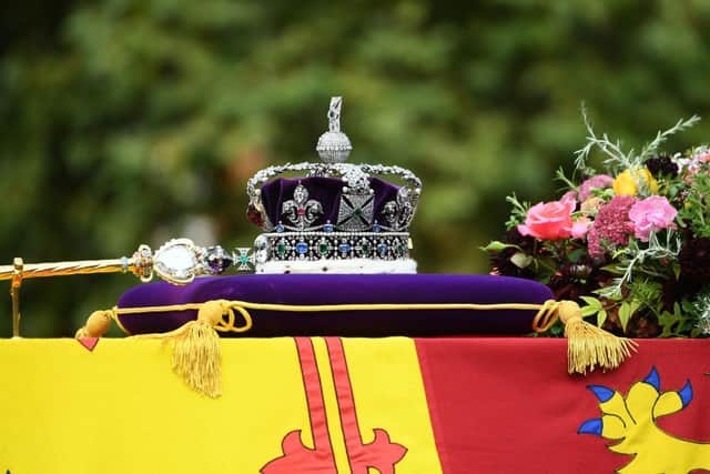LONDON, ENGLAND - SEPTEMBER 19: The coffin of Queen Elizabeth II with the Imperial State Crown resting on top is carried by the Bearer Party as it departs Westminster Abbey during the State Funeral of Queen Elizabeth II on September 19, 2022 in London, England. Elizabeth Alexandra Mary Windsor was born in Bruton Street, Mayfair, London on 21 April 1926. She married Prince Philip in 1947 and ascended the throne of the United Kingdom and Commonwealth on 6 February 1952 after the death of her Father, King George VI. Queen Elizabeth II died at Balmoral Castle in Scotland on September 8, 2022, and is succeeded by her eldest son, King Charles III.  (Photo by Joe Maher/Getty Images)
