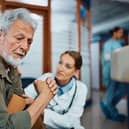 Man comforted by doctor