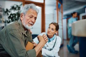Man comforted by doctor