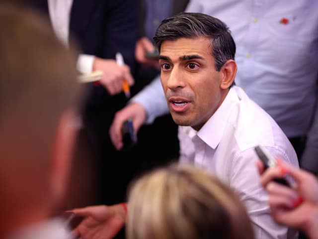 Prime Minister Rishi Sunak holds a "huddle" press conference with political journalists on board a Government plane as he heads to Bali, in Indonesia to attend the G20 summit. Picture date: Sunday November 13, 2022.