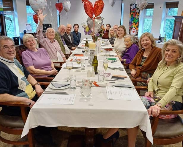 Audrey and Roger (both in middle) celebrating their 70th wedding anniversary with their family