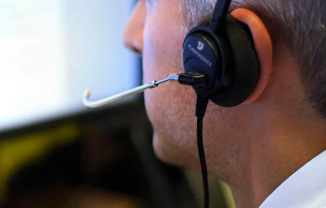 PICTURE POSED BY MODEL File photo dated 04/08/15 of an office worker on the phone as a last-ditch legal challenge to the controversial appointment of a G4S company to run a national helpline for people who may be victims of discrimination has been rejected by the High Court.