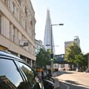 Steph charging her car near The Shard in London.