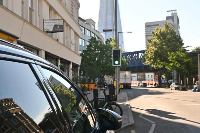 Steph charging her car near The Shard in London.