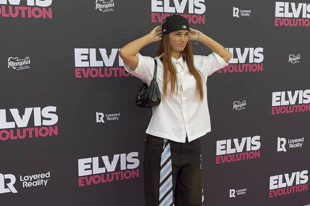 Honey Scott poses for photos on the pink carpet