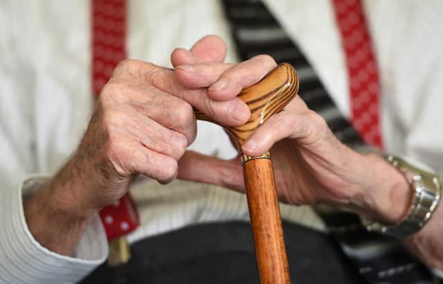 File photo dated 18/05/17 of an elderly man holding a walking stick, as three out of four care staff who look after people at home are not being paid for the time it takes them to travel between appointments, according to new research. Unison said its survey of more than 300 care workers across England revealed that employers are effectively breaking minimum wage laws, costing staff hundreds of pounds each month. Issue date: Thursday June 15, 2023.