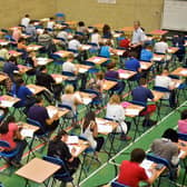 File photo dated 25/05/10 of students sitting an exam, as the Higher pass rate is down from last year but remains above 2019 levels, as more than 140,000 pupils across Scotland receive their exam results.